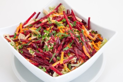salad of fresh beets and carrots in white plate